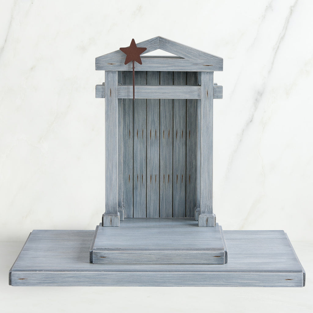 Grey wooden barn figurine open - brown star standing on it