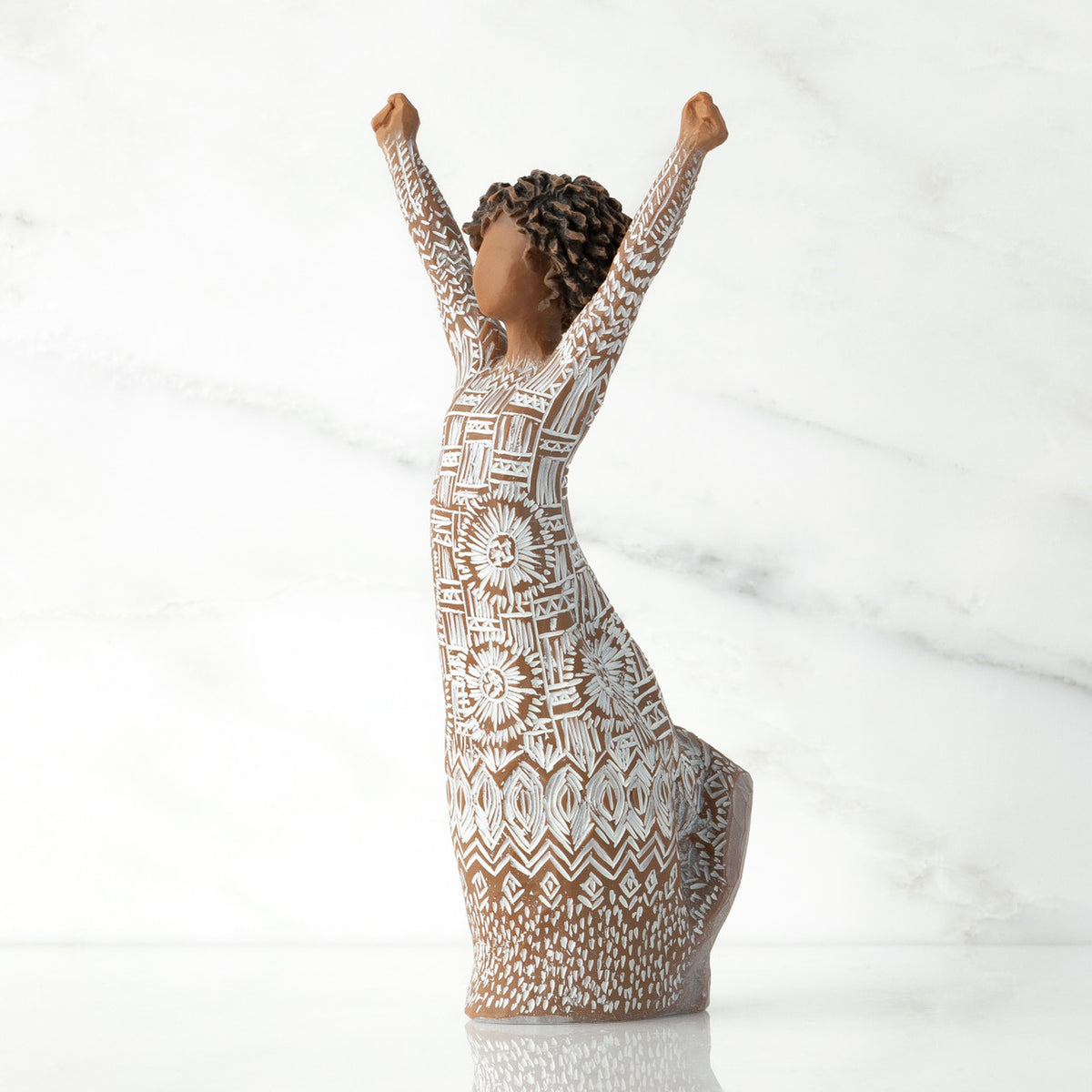 Figure turned to left, with dark natural hairstyle, arms raised overhead, dress entirely etched with African textile patterns