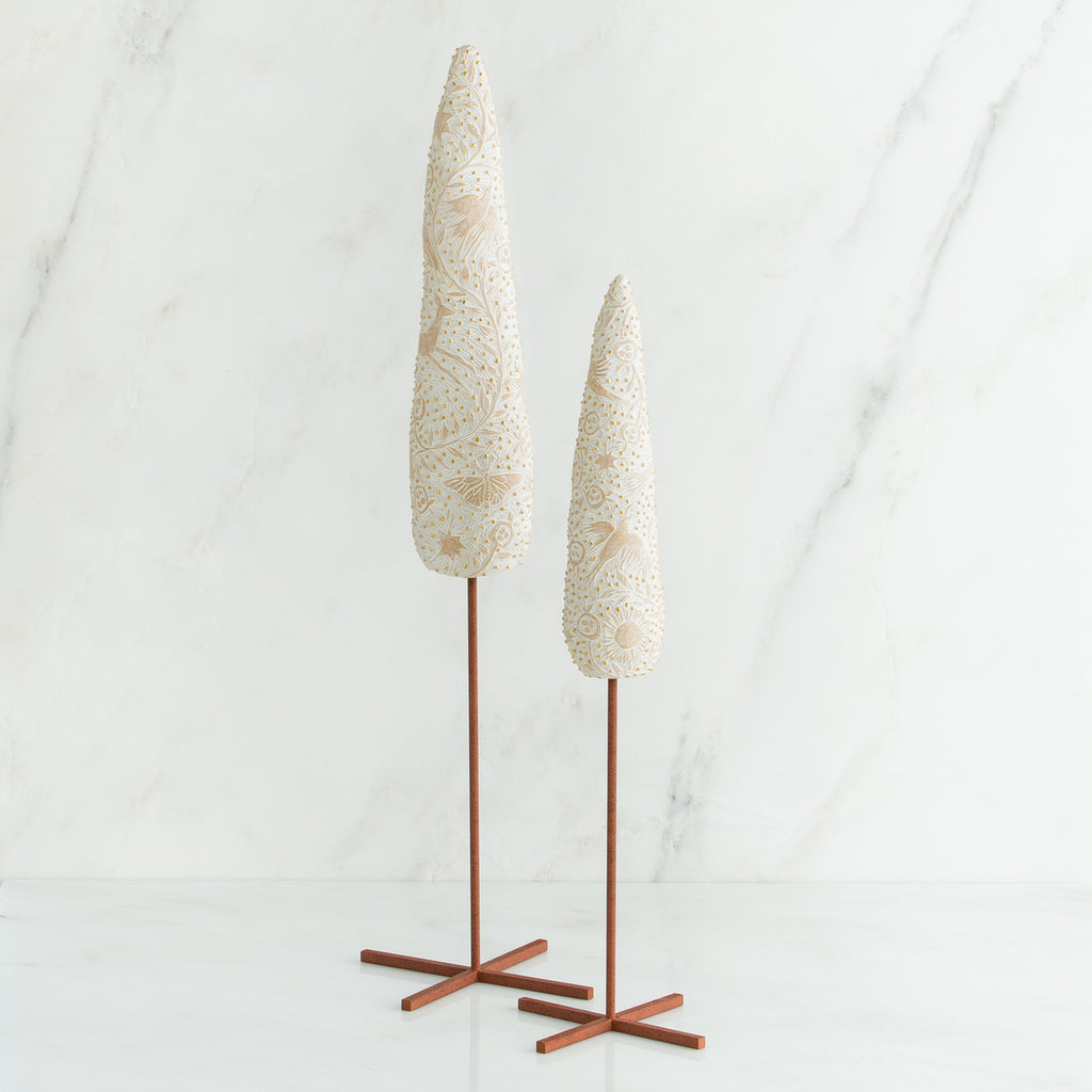 Set of two white tree figurines with wooden stands - all white background