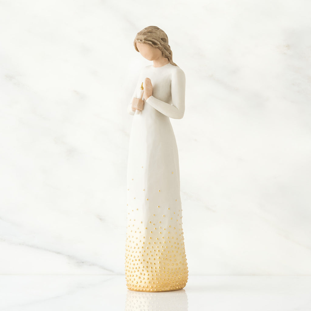Brunette girl figurine in white dress holding arms up