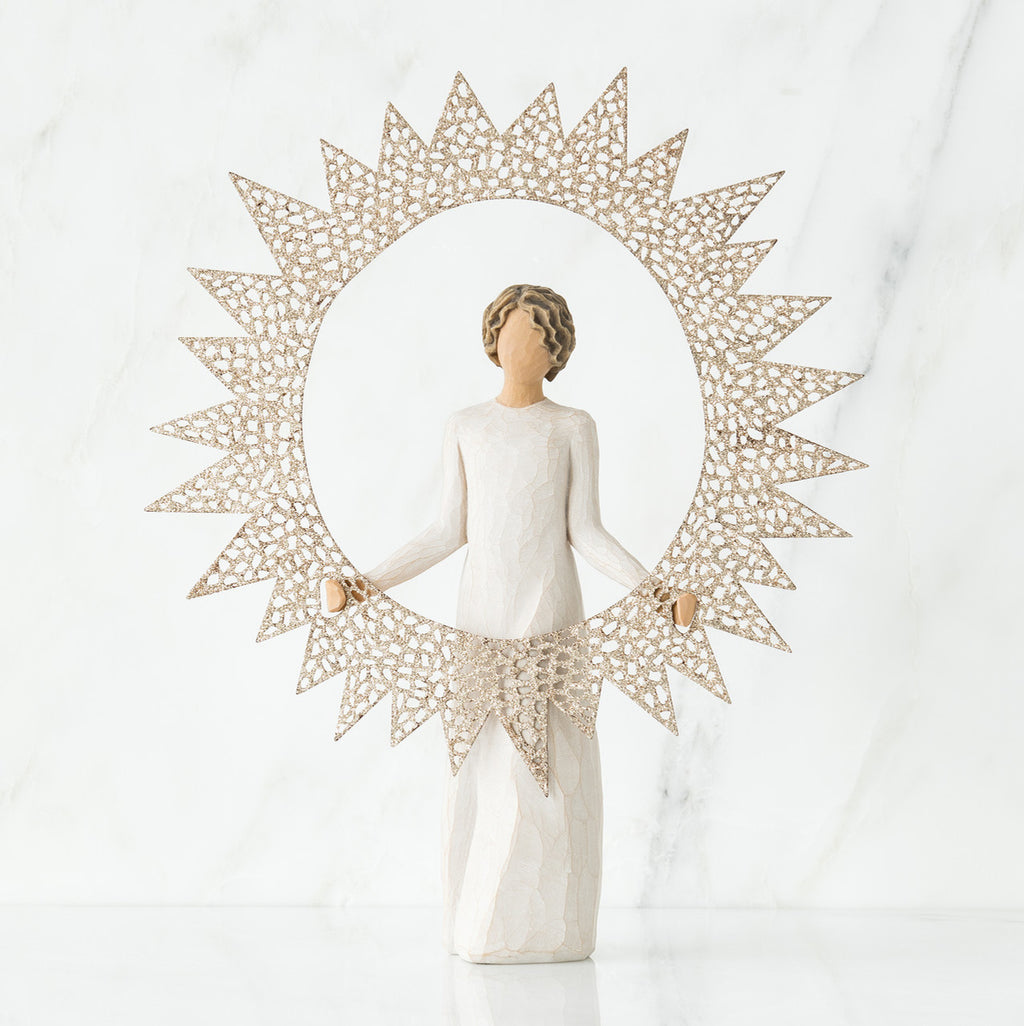 Brunette girl figurine in white dress standing facing forward holding large sun figurine