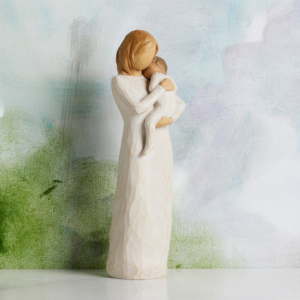 Willow Tree Child of my Heart, 9”h hand-painted standing resin figure holding toddler, both in cream clothes, in front of blue-grey painting