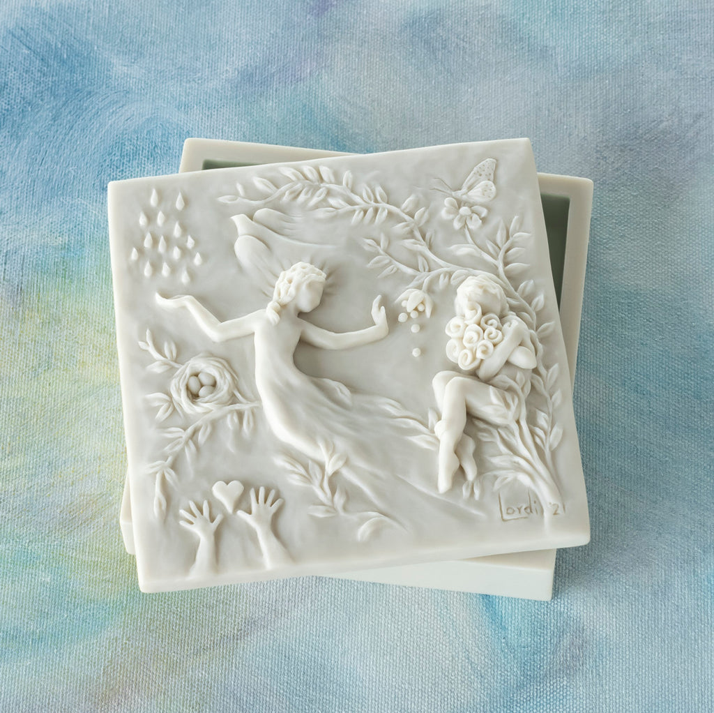 Willow Tree A Healing Wish Keepsake Box, 5"sq x 1.75"H hand-painted off-white resin box, detatched lid carved with organic/figural symbols, sentiment inside lid and velvety finish inside base, on blue painting
